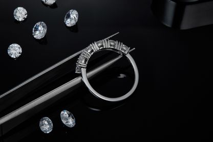 The Lumina Essence Ring - is crafted from S925 sterling silver plated with platinum and set with Moissanite stones.