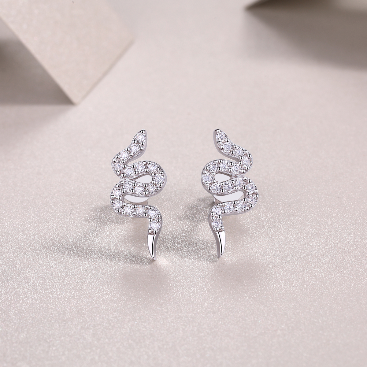 The Silver Snake Entwined Studs – Trendy Moissanite Earrings in Platinum-Plated S925 Silver